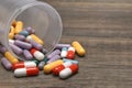 Many Colorful Pills And Capsules Dropped On Wooden Background Royalty Free Stock Photo