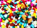 Many colorful pills, tablets and capsules medical drug. Concept