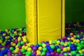 Many colorful plastic balls in a kids& x27; ballpit at a playground Royalty Free Stock Photo