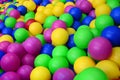 Many colorful plastic balls in a kids& x27; ballpit at a playground. Royalty Free Stock Photo