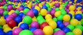 Many colorful plastic balls in a kids& x27; ballpit at a playground. Royalty Free Stock Photo