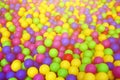 Many colorful plastic balls in a kids& x27; ballpit at a playground. Royalty Free Stock Photo