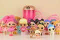 Many colorful plastic LOL dolls on table. LOL Surprise series toys manufactured by MGA Entertainment inc.