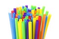 Many colorful plastic straws with opening upwards isolated