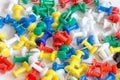 Many colorful push pins on the background, close-up Royalty Free Stock Photo