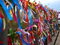 Many colorful ribbons on the fence selective focus and blurred background Royalty Free Stock Photo