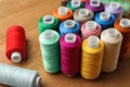 Many colorful sewing threads on wooden table Royalty Free Stock Photo