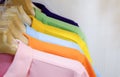 Many colorful shirts hanging on a rack Royalty Free Stock Photo