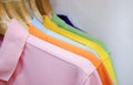 Many colorful shirts hanging on a rack Royalty Free Stock Photo