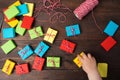 Many colorful small gift boxes with kids hand to take one box