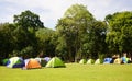 Many colorful Tents on the grass fields at Huay Kamin Waterfall