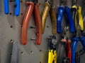 Many colorful tools on the stand in the workshop Royalty Free Stock Photo