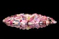 Many colorful Tourmaline splinter in front of black background w