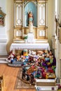 Many colorful toys in front of the altar in the church