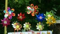 Many colorful toys weathervanes in a park shop.