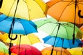 Many colorful umbrellas against the sky in city settings. Kosice, Slovakia Royalty Free Stock Photo