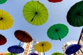 many colorful umbrellas fly and hover on the city street Royalty Free Stock Photo