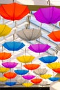 Many colorful umbrellas hanging from the ceiling under glassed roof Royalty Free Stock Photo