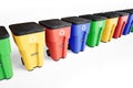 Many colorfull plastic garbage bins with recycling logo, staked on row.