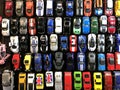 Many small toy cars lined up on the board