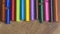 Many colourful used crayon in a row