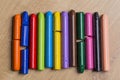 Many colourful used crayon in a row