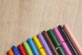 Many colourful used crayon in a row Royalty Free Stock Photo