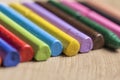 Many colourful used crayon in a row