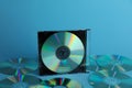 Many compact discs on light blue background Royalty Free Stock Photo