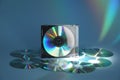 Many compact discs on light blue background Royalty Free Stock Photo