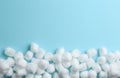 Many cotton balls and space for text on blue background Royalty Free Stock Photo