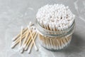 Many cotton buds on light grey marble table Royalty Free Stock Photo