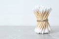 Many cotton buds on light grey marble table, space for text Royalty Free Stock Photo