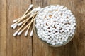 Many cotton buds on wooden table, flat lay Royalty Free Stock Photo