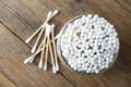 Many cotton buds on wooden table, flat lay Royalty Free Stock Photo