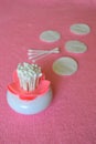 Many cotton ear swabs, pads. Pink background Royalty Free Stock Photo