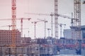 Many cranes and construction workers on construction site Royalty Free Stock Photo