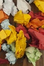 Many crumpled colorful paper background. Close-up
