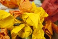 Many crumpled colorful paper background. Close-up