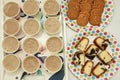Many cups of hot tea with biscuits and cakes Royalty Free Stock Photo