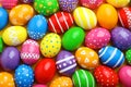 Many decorated Easter eggs as background, top view