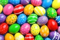 Many decorated Easter eggs as background, top view