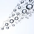 many delicate droplets arranged in a curving and flowing droplt