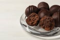 Many delicious chocolate truffles on white table, closeup. Space for text Royalty Free Stock Photo