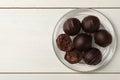 Many delicious chocolate truffles on white wooden table, top view. Space for text Royalty Free Stock Photo