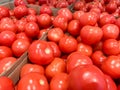 Many delicious red tomatoes in supermarket, whole fresh organic vegetables for sale at a farm market Royalty Free Stock Photo