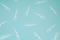 Many dental floss picks on blue color background, top view. Royalty Free Stock Photo