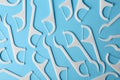 Many dental floss picks on color background, top view. Royalty Free Stock Photo