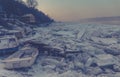 Many destroyed boats on a frozen Danube river haze effect Royalty Free Stock Photo