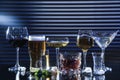 Many different alcoholic drinks on table against dark background Royalty Free Stock Photo
